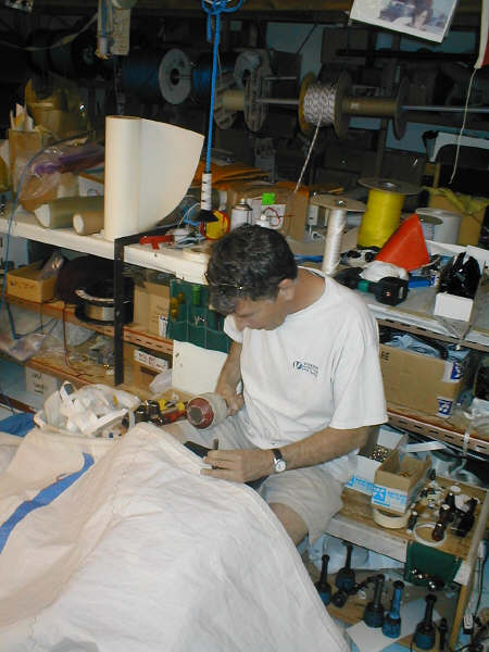 Dan-Pounding Grommets into sail